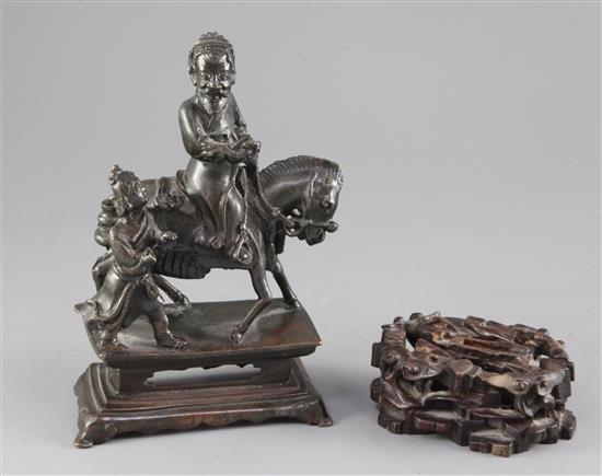 A Chinese bronze group of a sage on horseback with attendant, probably 17th century, 10cm (2)